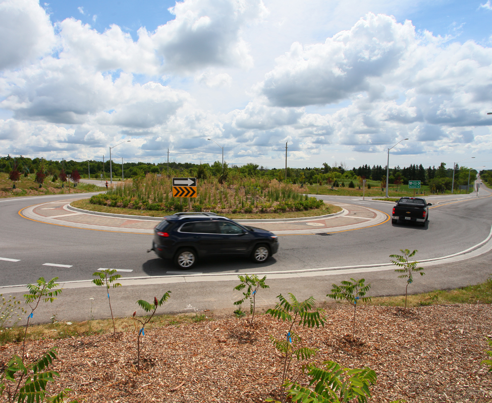 cars driving through a roundabout